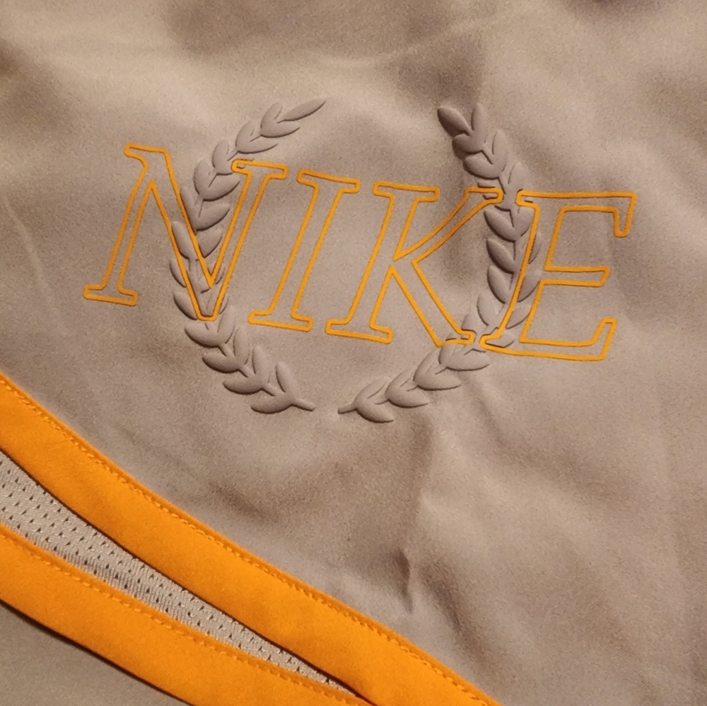 NWT! Nike dri-fit women's running shorts. Size small color's gray and orange.